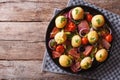 New potatoes with bacon on a plate in a rustic style. Royalty Free Stock Photo