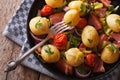 New potatoes with onions and bacon horizontal top view Royalty Free Stock Photo