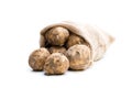 New potatoes in sackcloth bag isolated on white Royalty Free Stock Photo