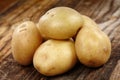 New potatoes on wooden board Royalty Free Stock Photo