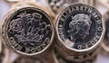 New pound coin introduced in Britain, front and back Royalty Free Stock Photo