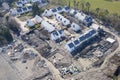 New private housing development construction in rural countryside aerial view