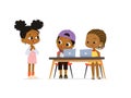 New pupil greeting classmates sitting at table. Happy African American children sitting at laptops and learning Royalty Free Stock Photo