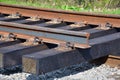New railroad section ready for installation. Brand new wooden ties covered with creosote. Royalty Free Stock Photo