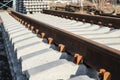 New rails and sleepers. The rails and sleepers are stacked on each other. Renovation of the railway. Rail road for the train Royalty Free Stock Photo