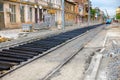 New rails and wooden sleepers are prepared for laying on gravel Royalty Free Stock Photo