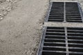 New rainwater grate on the road or sidewalk, installation in concrete. City sewage system for draining water during heavy rain