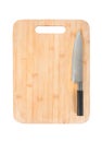 New rectangular wooden bamboo cutting board and kitchen knife isolated on white background Royalty Free Stock Photo