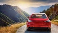 A new red car pulled over on the side of a remote mountain road Royalty Free Stock Photo