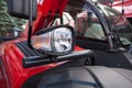 New red tractor headlight close up. Royalty Free Stock Photo