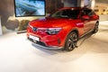 new red Vinfast electric crossover in showroom, trends EV in Europe, technological advancements in automotive industry,