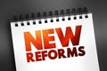 New Reforms text quote on notepad, concept background Royalty Free Stock Photo