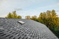 new renovated roof covered with shingles flat polymeric roof-tiles Royalty Free Stock Photo