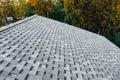 New renovated roof with shingles flat polymeric roof-tiles Royalty Free Stock Photo