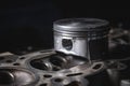 a new repair piston of the internal combustion engine lies on a disassembled engine in the workshop Royalty Free Stock Photo