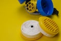 New replacement filters and Industrial respirator on yellow background