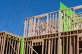 New residential construction home framing against a blue sky Royalty Free Stock Photo