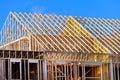 New residential construction home framing against a blue sky roofing construction Royalty Free Stock Photo