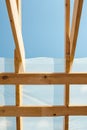 New residential construction home framing against a blue sky. Roofing construction. Wooden construction. Royalty Free Stock Photo