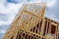 New residential construction home framing against a blue sky roofing construction wooden construction Royalty Free Stock Photo