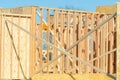 new residential construction home framing against a blue sky roofing construction wooden construction Royalty Free Stock Photo
