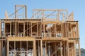 New residential construction home framing against a blue sky Royalty Free Stock Photo