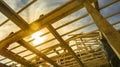 New residential construction home framing against a sunset Royalty Free Stock Photo