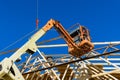 New residential construction home framing against a crane holds is new in wood roofing Royalty Free Stock Photo