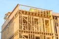 new residential construction house framing against a blue sky Royalty Free Stock Photo