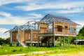 New residential construction house framing against a blue sky an Royalty Free Stock Photo