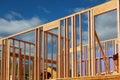 New residential construction house framing against a blue sky. Royalty Free Stock Photo