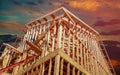 New residential construction house framing against a sunset Royalty Free Stock Photo