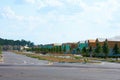 New residential neighborhood under construction with half built homes and newly planted trees in South Florida to address a