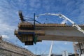 New road bridge being built. New part is hanging in the air