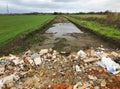 New road built in a field filled with rumble and debris Royalty Free Stock Photo