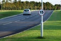 New road with speed restriction sign.