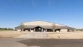 New rodeo arena open farmland clear blue sky front entrance