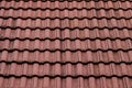 New roof with ceramic tiles, Orange roof tiles - European rounded roof-tiles, Brown terra cotta roof tiles texture and background Royalty Free Stock Photo