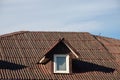 New roofing construction with attic skylights, rain gutter system, roof windows and roof protection from snow board Royalty Free Stock Photo