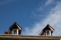 New roofing construction with attic skylights, rain gutter system, roof windows and roof protection from snow board Royalty Free Stock Photo