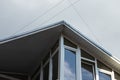 New roofing construction with attic skylights, rain gutter system, roof windows and roof protection from snow board Royalty Free Stock Photo