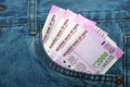 New 2000 rupee notes in an Indian mans jean front pocket. Royalty Free Stock Photo