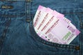 New 2000 rupee notes in an Indian mans jean front pocket. Royalty Free Stock Photo