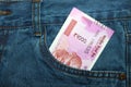 New 2000 rupee notes in an Indian mans jean front pocket. Royalty Free Stock Photo