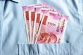 New 2000 rupee notes in an Indian mans shirts front pocket. Royalty Free Stock Photo