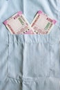 New 2000 rupee notes in an Indian mans shirts front pocket. Royalty Free Stock Photo