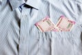 New 2000 rupee notes in an Indian mans shirts front pocket. Royalty Free Stock Photo