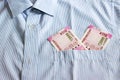 New 2000 rupee notes in an Indian mans shirts front pocket. Royalty Free Stock Photo