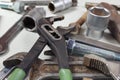 New and rusty wrenches, nuts, bolts and nuts for mechanical work closeup