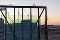 New sealed glass units at building site against the backdrop of a sunset sky. Storage and preparation at the installation of